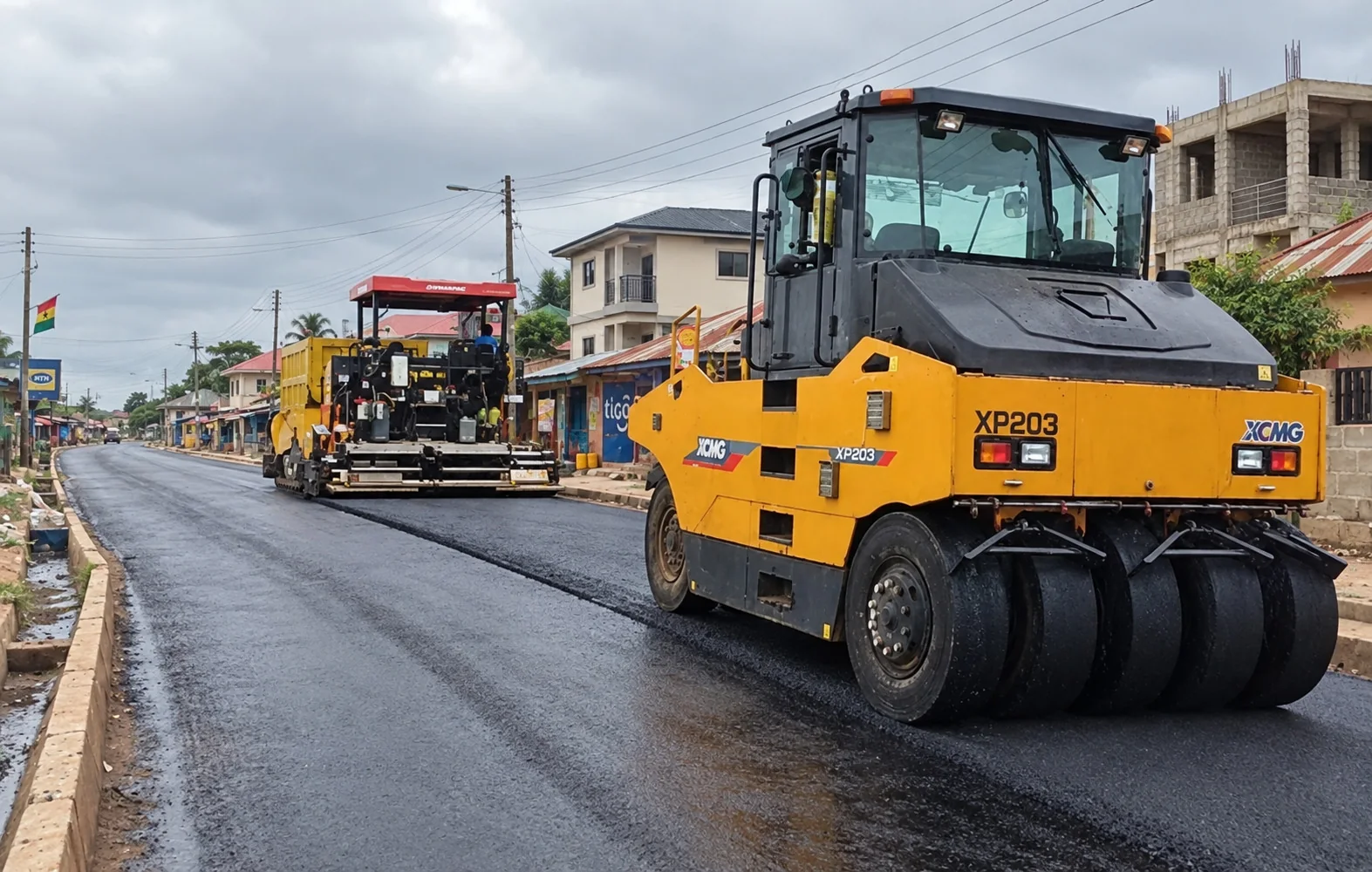 Road construction equipment on fresh pavement
